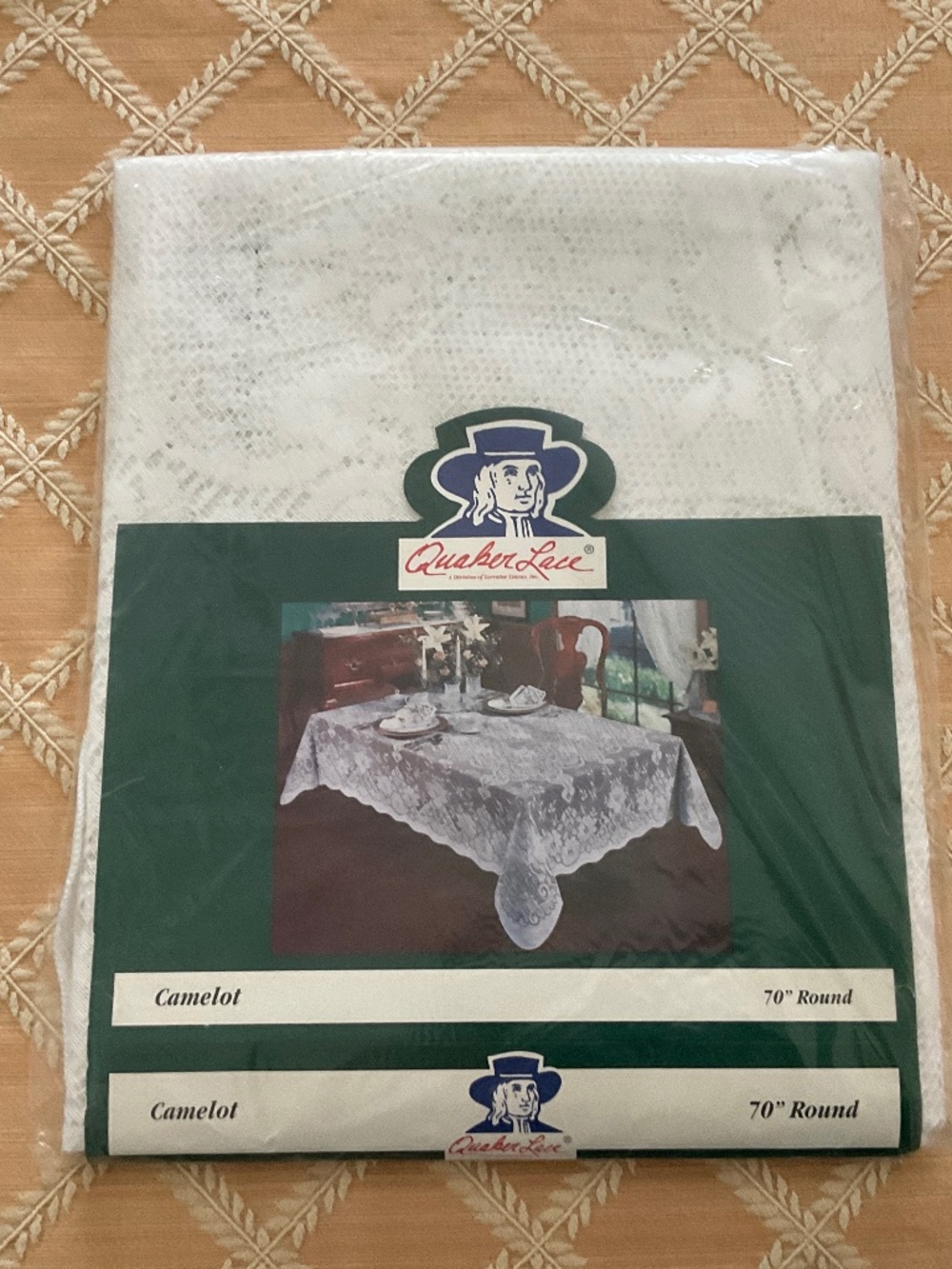 Vintage white Quaker Lace tablecloth.  Original pkg.  70” round.  Never unfolded